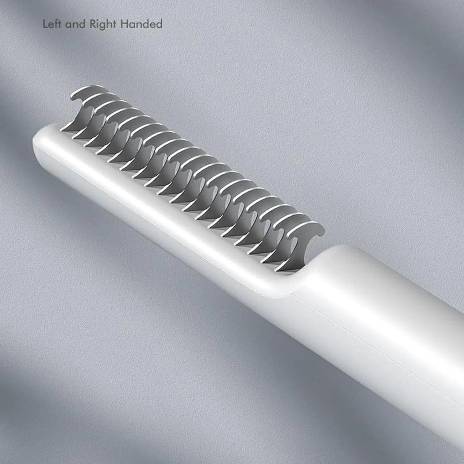 Stainless steel dematting comb for dogs with a user-friendly handle on a pink background.