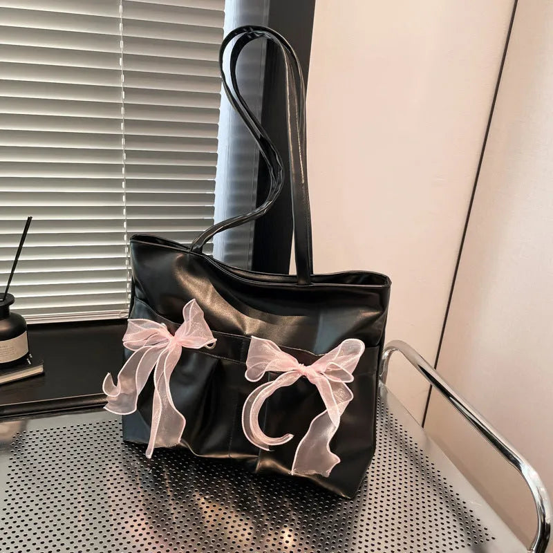 College style bow tote bag in black with double shoulder straps and large capacity design