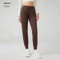 Women's high waist yoga pants with drawstring waistband in quick-drying fabric, available in multiple colours