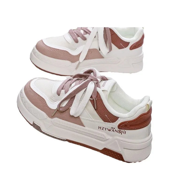 Children's beige platform shoes with front lace-up closure and an overfoot cross-strap on a thick rubber sole.