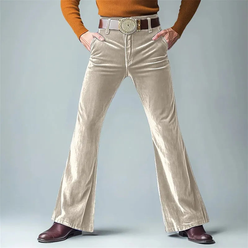 Man wearing slim-fit gold velvet flared suit pants in a solid colour, suitable for banquet or formal casual wear.