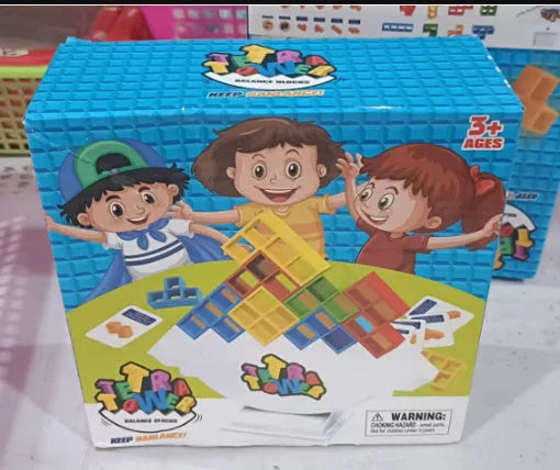 Plastic balance stacking board game with colourful blocks, chassis, and base on table