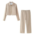 Women's light coloured herringbone pattern summer suit with jacket and straight-leg trousers, showing 3D pattern effect and embroidery details.