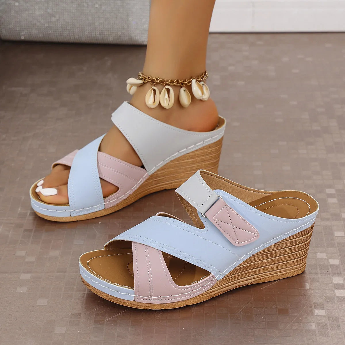 Women's black and white platform wedge slippers with a Velcro strap and fish mouth toe design.