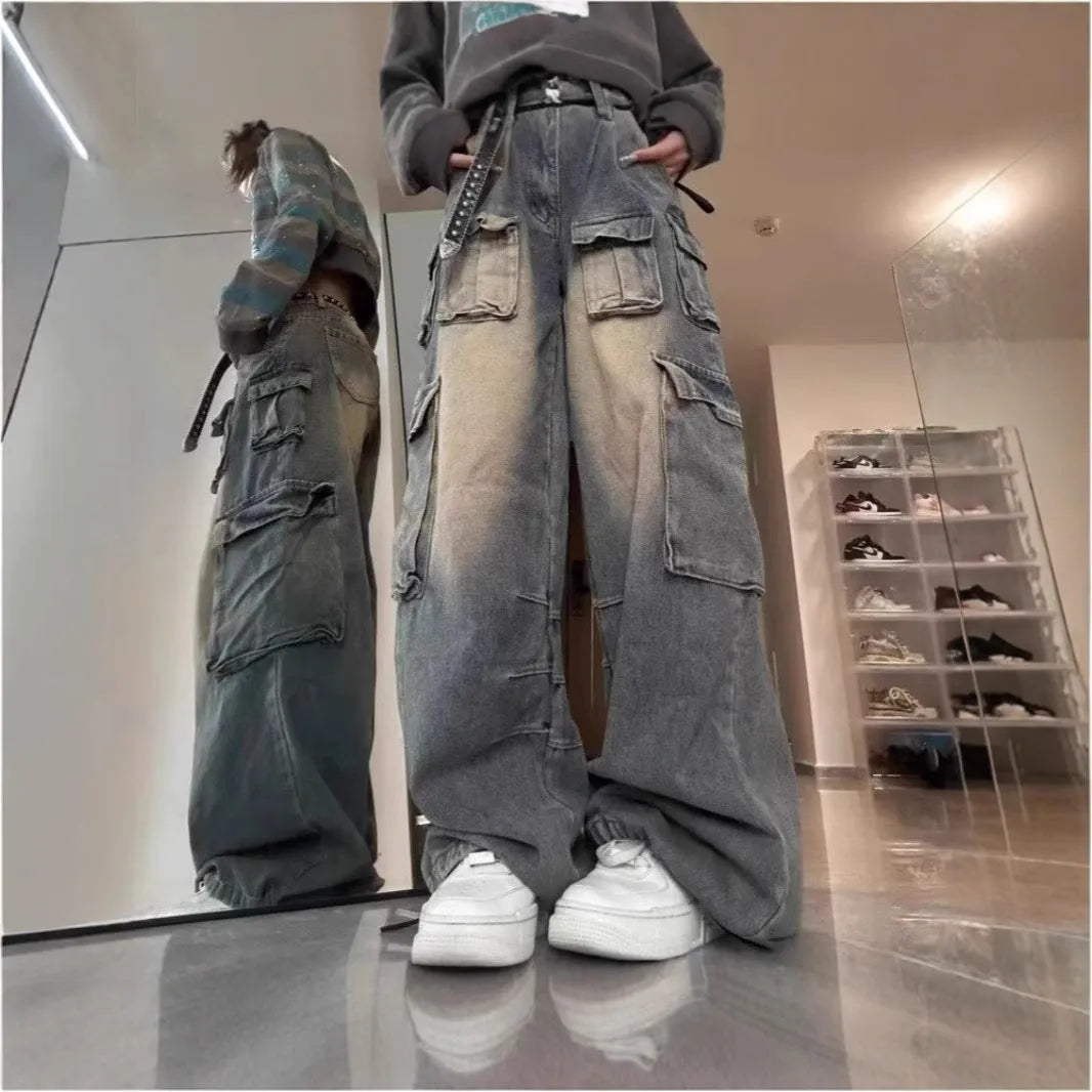 Men's loose fit distressed denim jeans with multiple utility pockets in light blue or black colours