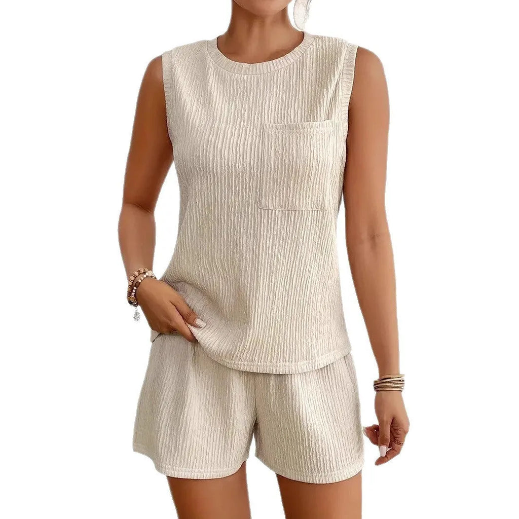 Women's apricot coloured sleeveless vest top and matching shorts lounge set on a hanger.