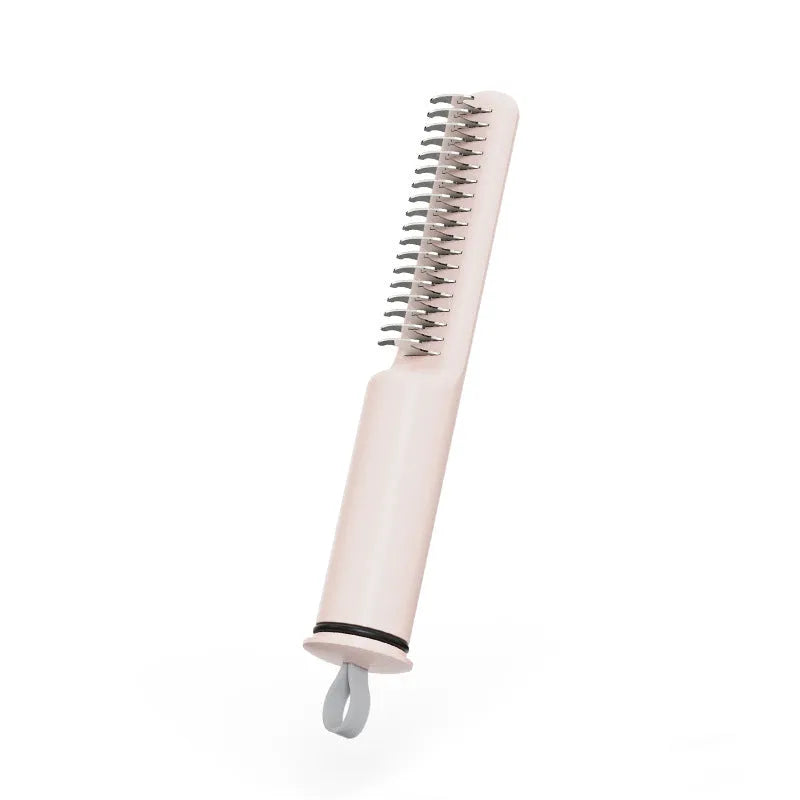 Stainless steel dematting comb for dogs with a user-friendly handle on a pink background.