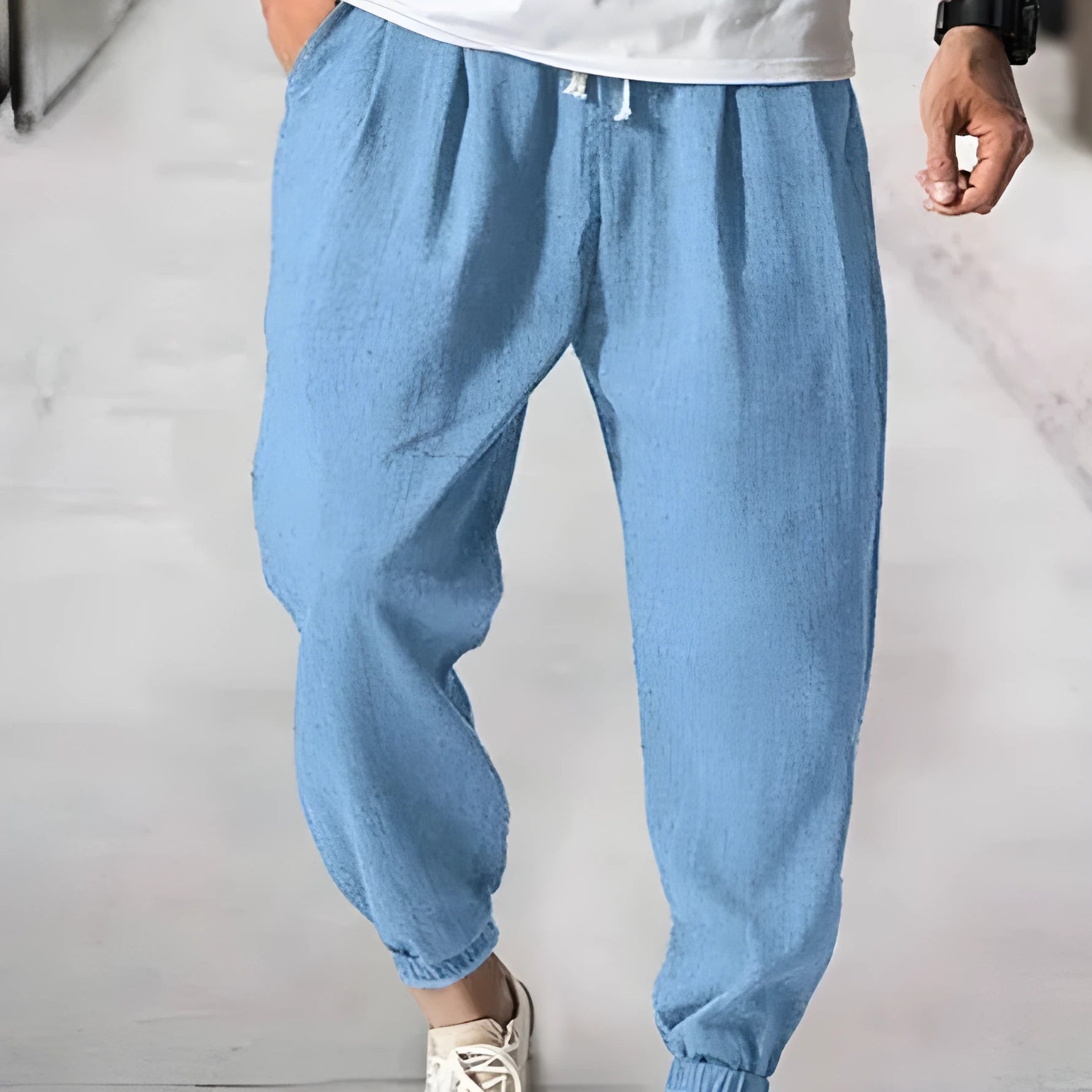 Men's loose cotton casual trousers with elasticated ankle bands in light green