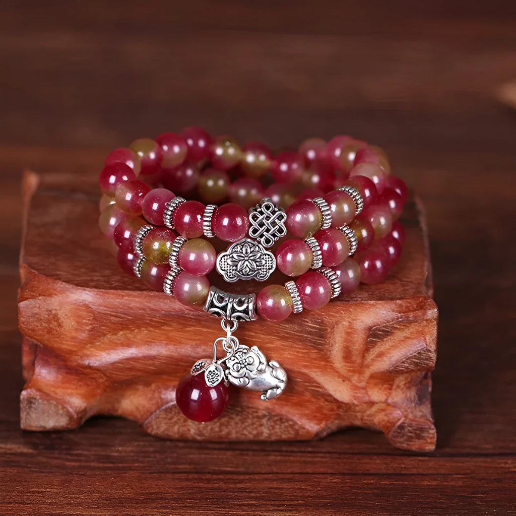 Handmade watermelon crystal bracelet with Chinese knot and elephant beads in 6mm or 8mm size.