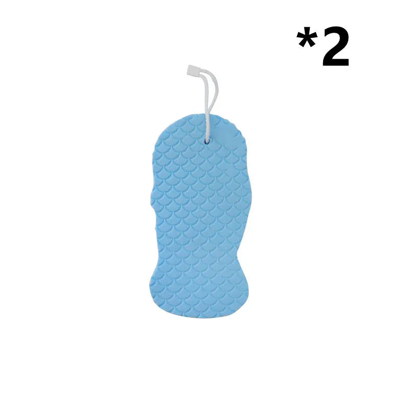 White 3D fish scale pattern bath sponge ball with hanging loop on a grey background.