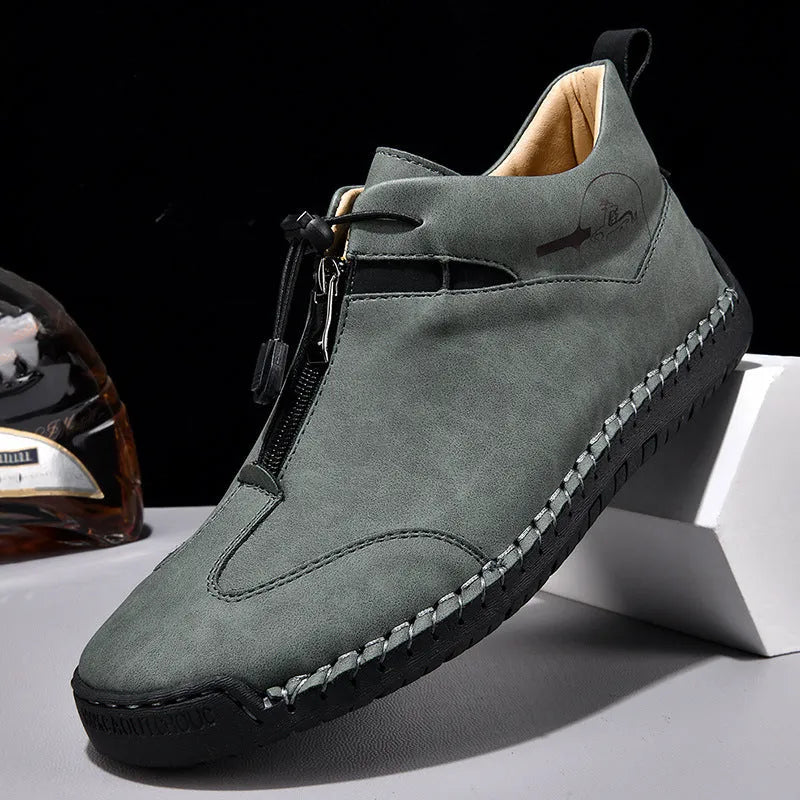 Men's casual leather shoe in green with round toe, mid-heel, and visible sewing thread detail.