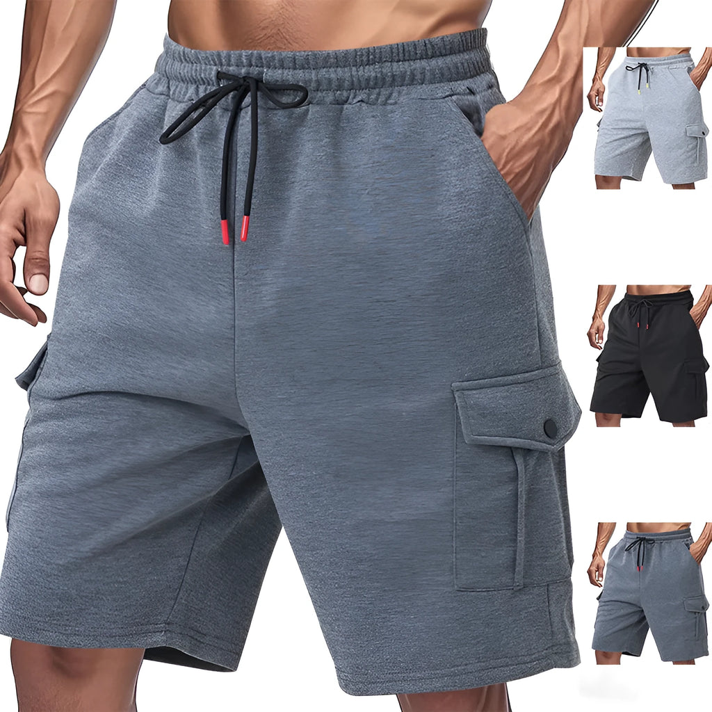 Man wearing light grey loose-fit cargo shorts made from textured towel fabric with multiple pockets.