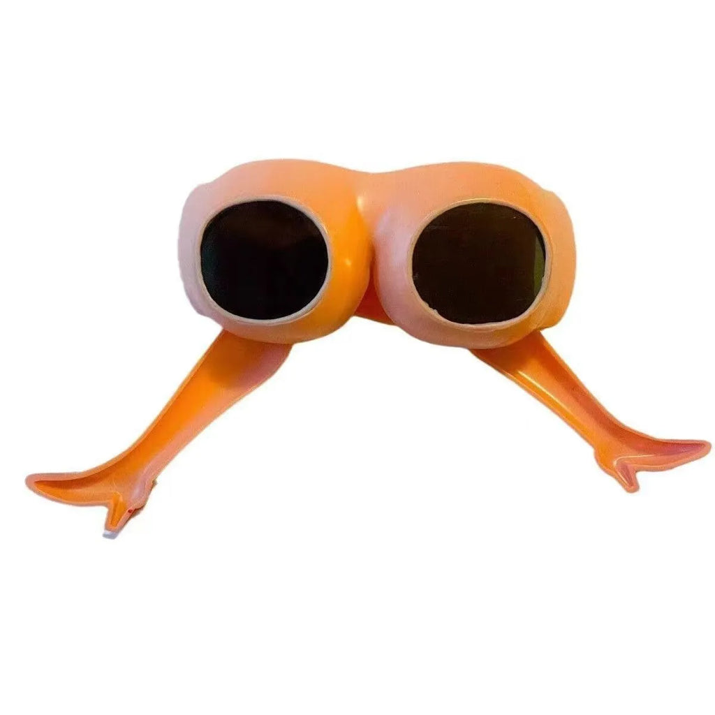 Orange plastic novelty sunglasses with a leg hip frame design on a white background.