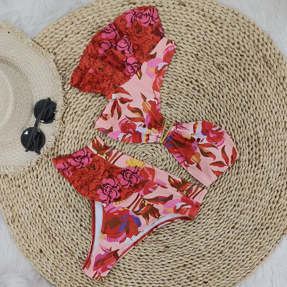 Pink floral print women's one-shoulder ruffled swimsuit with high-waist bikini briefs.