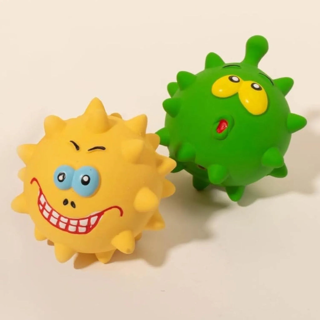Four colourful latex squeaky dog toy balls with cute animal faces and textured surfaces