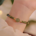 Hetian Jade bracelet in geometric round shape showing dark green and light colour options