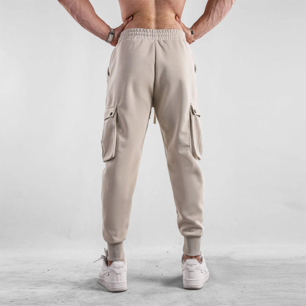 Men's loose cotton sports trousers with ankle-tied cuffs and multiple pockets in various colour options