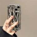 Silicone iPhone 17 case with water ripple texture in green, showing form-fitting design and protective edges.