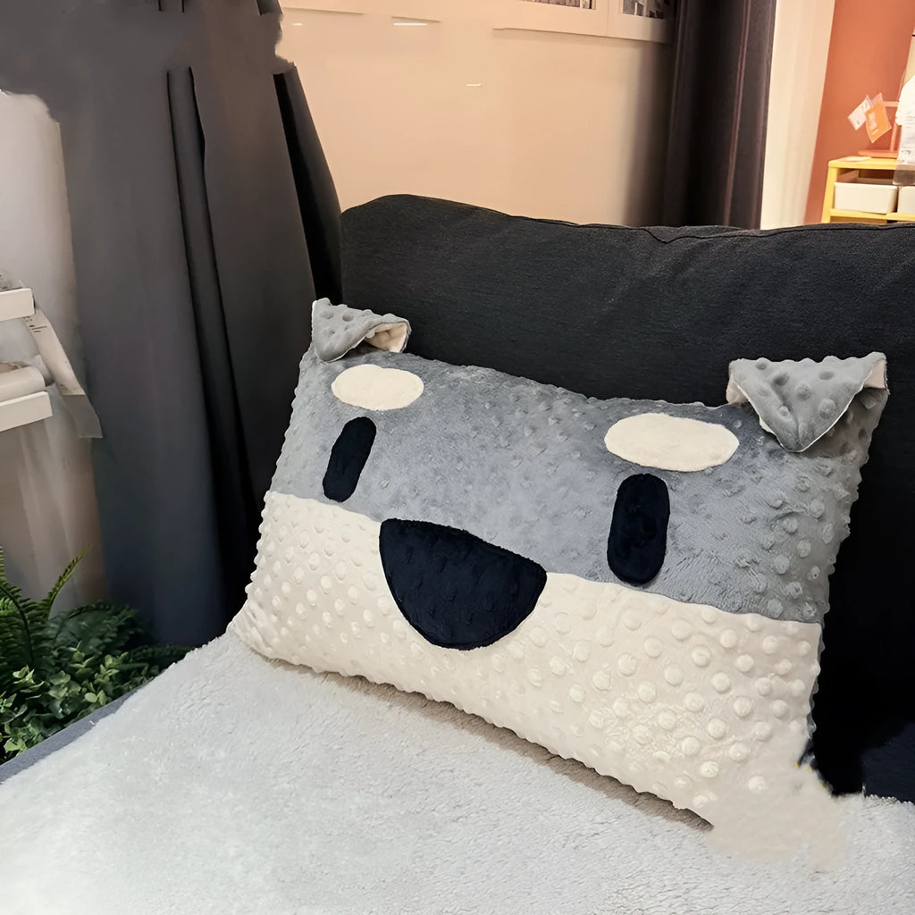 Grey and white West Highland puppy decorative cushion on sofa