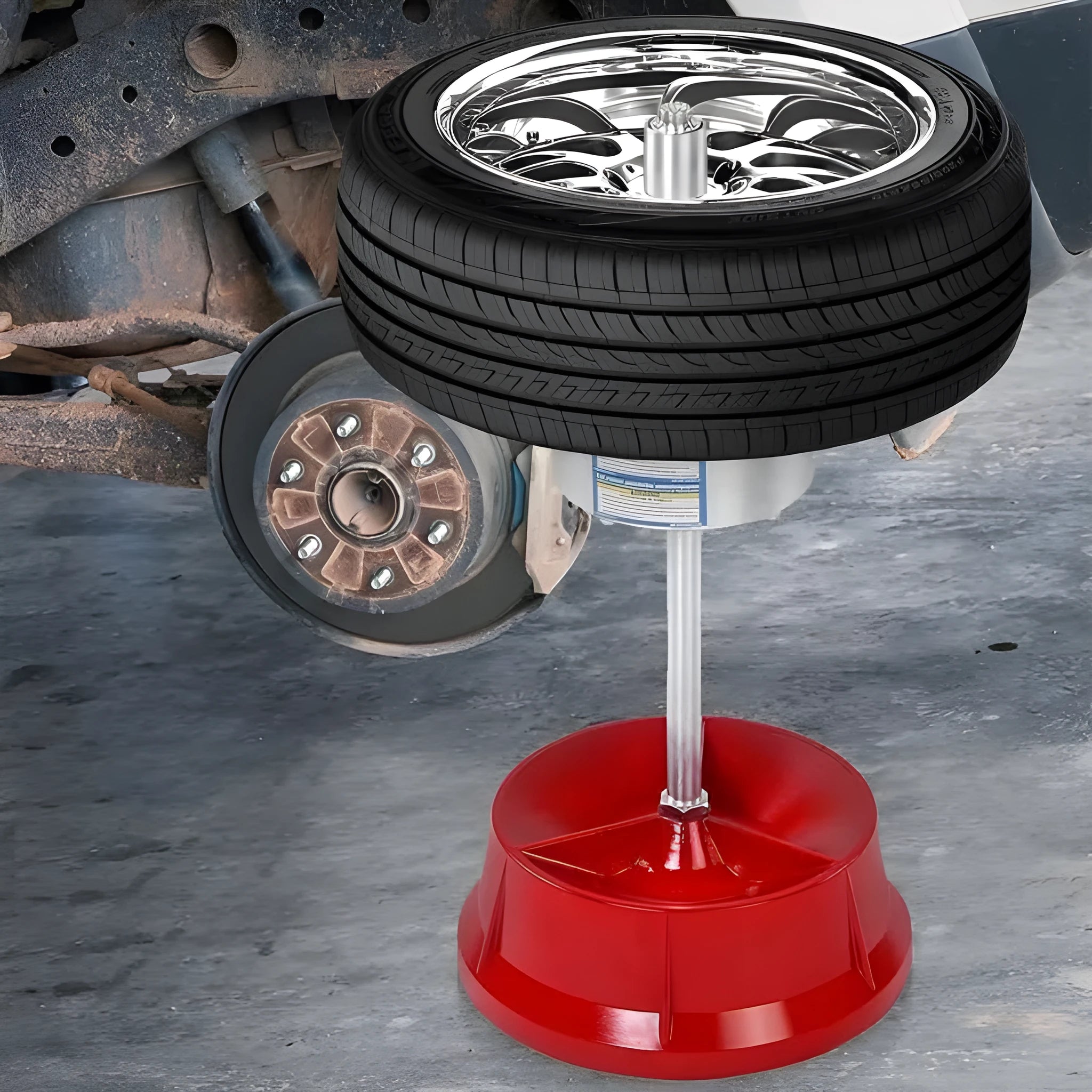 Portable hub balancer tool with aluminium head and enamel-finished base for wheel balancing.