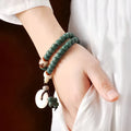 White Jade and green Sandalwood Bodhi seed bracelet with double ring safety buckle and Lotus design