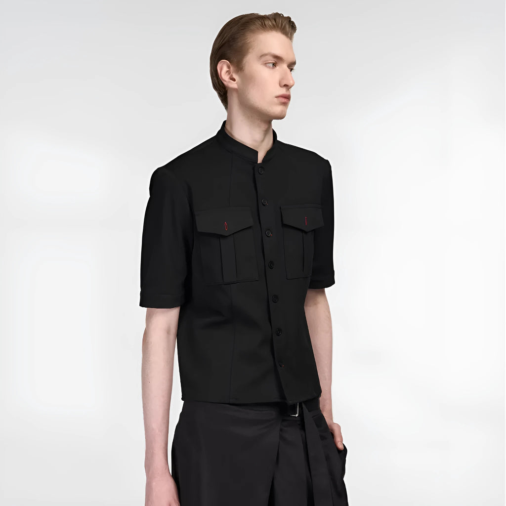 Black handmade Red Eye half sleeve hunting shirt with a shirt collar on a hanger.