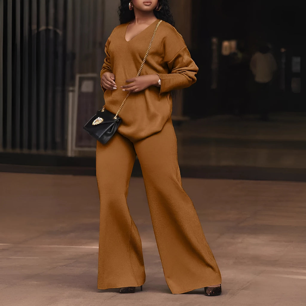 Brown women's suede velvet two-piece suit with long sleeves and full-length trousers on a model.