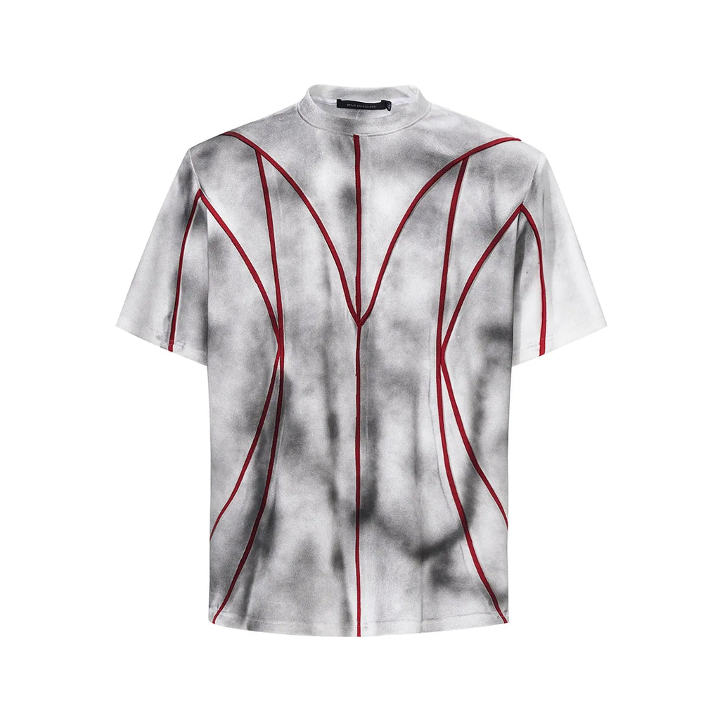 Women's grey padded shoulder t-shirt with textured patchwork design on the front.