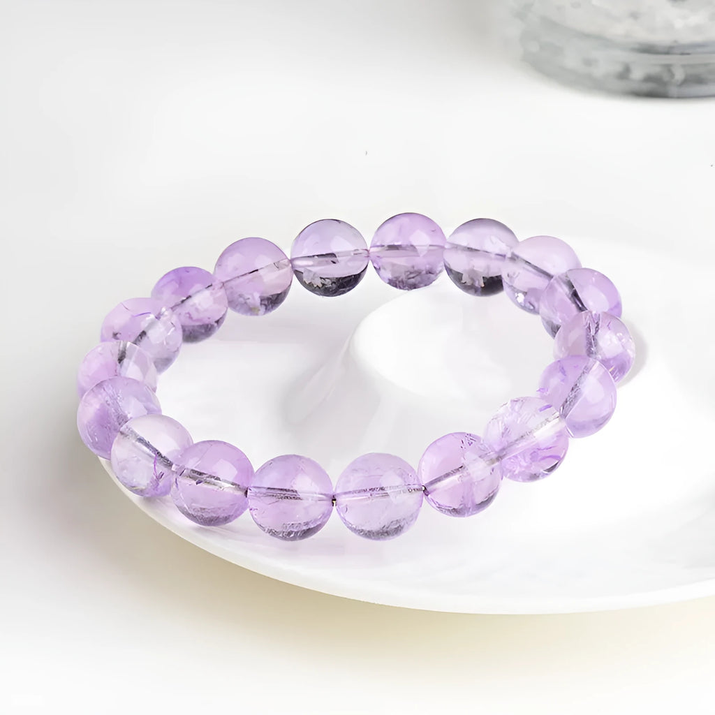Lavender amethyst crystal bracelet with water ripple pattern on round beads in light purple colour