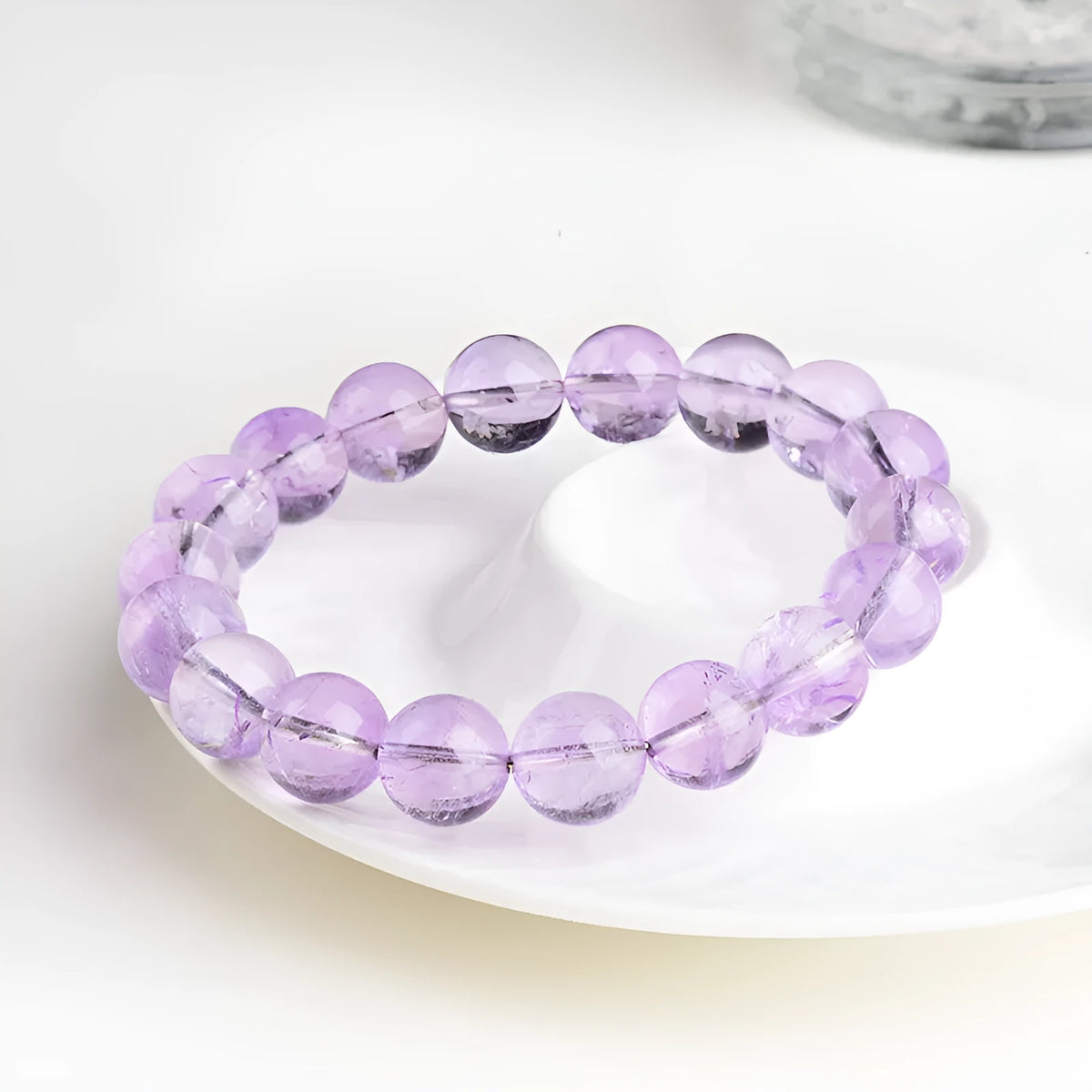 Lavender amethyst crystal bracelet with water ripple pattern on round beads in light purple colour