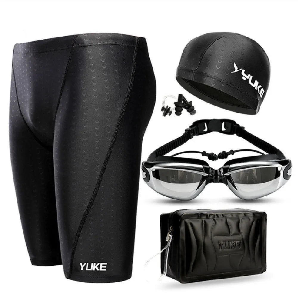 Men's black polyester swimming trunks set with anti-fog goggles, waterproof cap, ear plugs, nose clip, and carry bag.