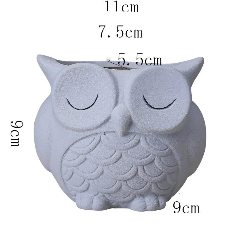 Handmade ceramic owl-design succulent pot in pastel colour measuring 11cm by 9cm by 9cm