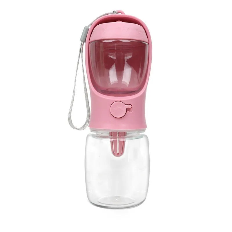 Blue portable plastic dog water bottle with integrated drinking trough for outings.