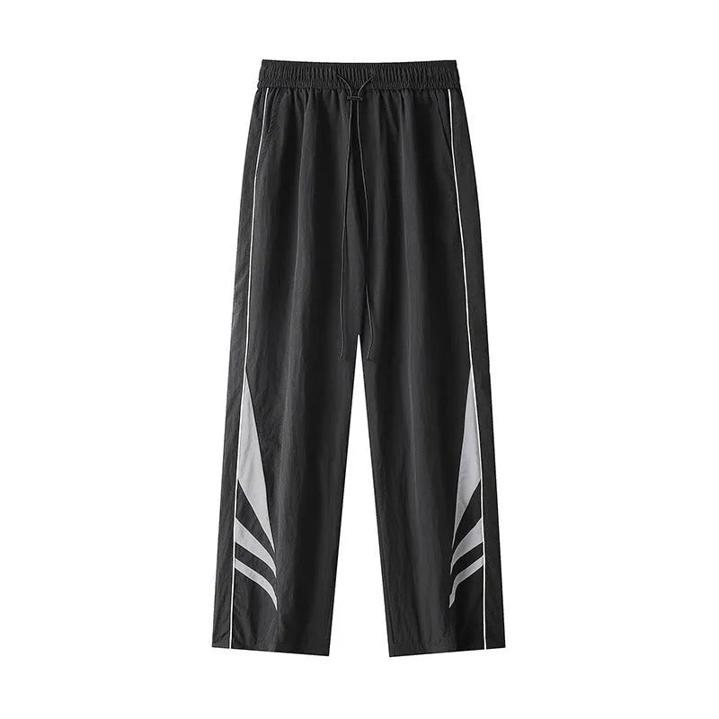 Men's straight-leg loose fit sports trousers in grey fabric with an elasticated waistband.