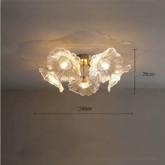 White flower pendant ceiling lamp with five flower heads emitting warm light in modern bedroom