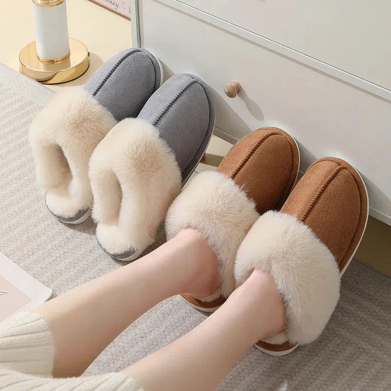 Women's plush winter slippers in pink with a round toe, flat heel, and anti-slip PVC sole.