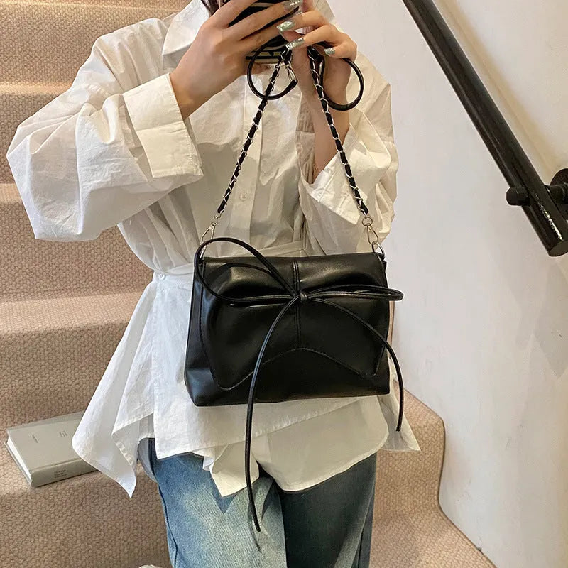 Women's large capacity horizontal square underarm bag in black PU with sandwich pocket and crossbody strap