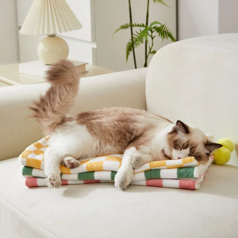 Plaid pattern pet blanket with fur ball decoration in green, pink, or yellow colours