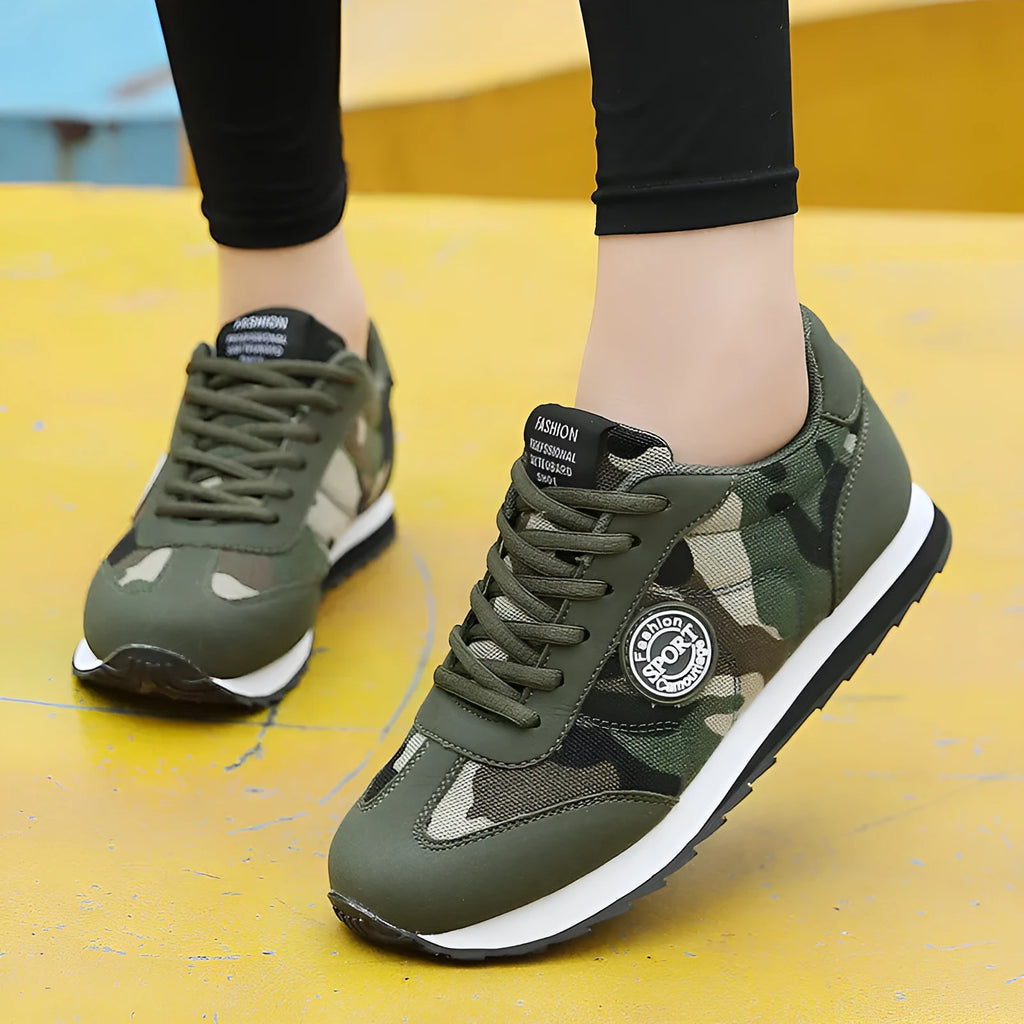 Green camouflage suede low-top sports shoes with a flat foam sole and mesh lining.
