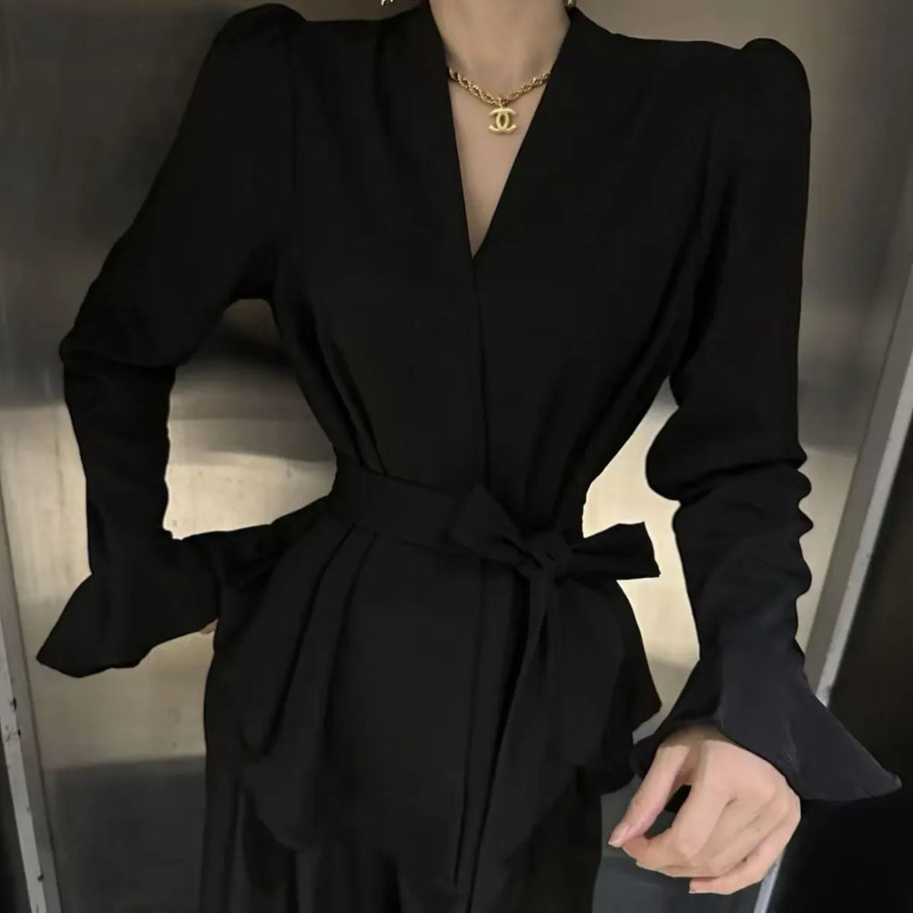 Women's black French-style shirt with irregular collar and long bell sleeves tied at waist