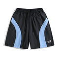 Men's black loose fit sports shorts with elastic waistband and contrast trim, shown on a hanger.