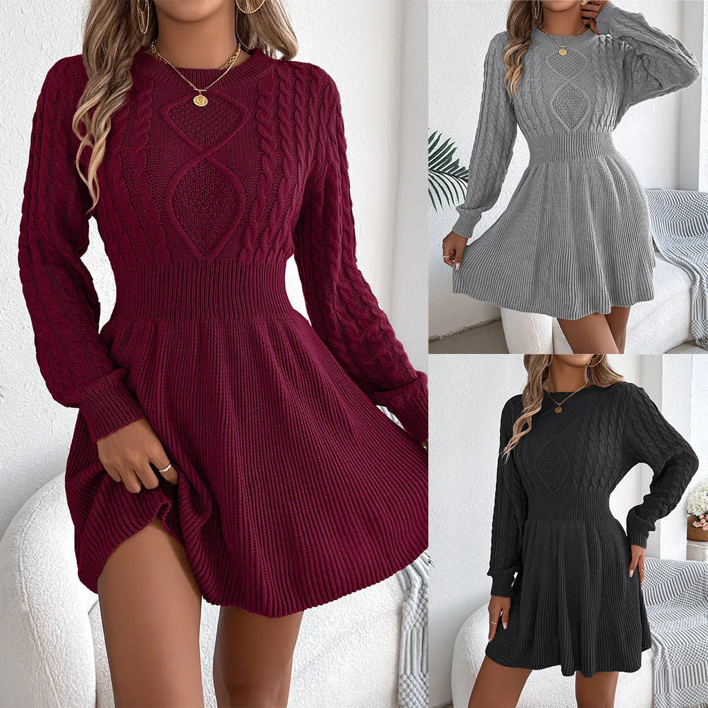 Black knit sweater dress with lantern sleeves and a twisted elastic waistband.
