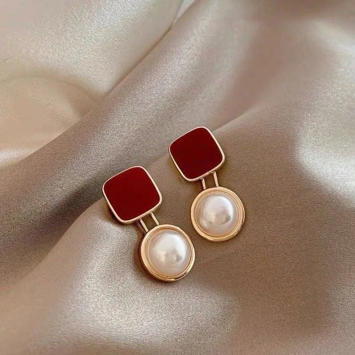 Red and blue geometric alloy stud earrings with pearl detail and quadrilateral shape, one pair