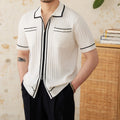 Slim black and white lapel polo shirt with short sleeves on a hanger