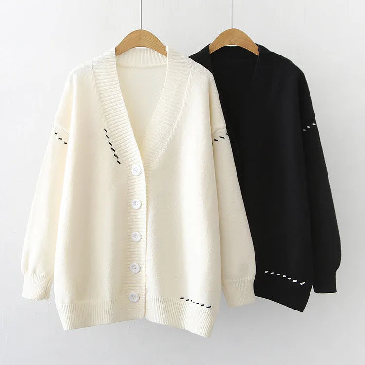Women's polyester knitted cardigan coat in black or white with long sleeves