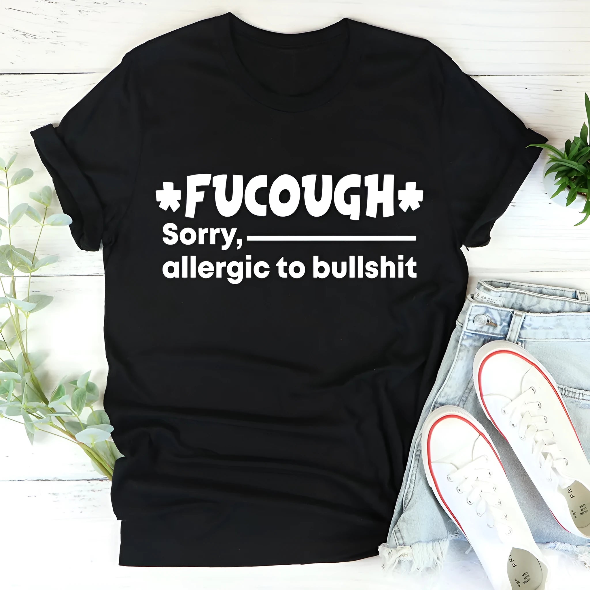 Black cotton T-shirt with loose short sleeves and round neck collar on mannequin