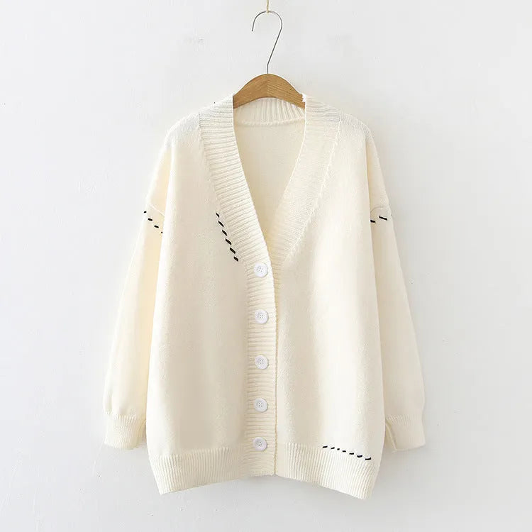 Women's polyester knitted cardigan coat in black or white with long sleeves
