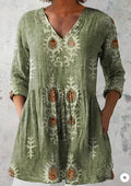 Women's loose-fitting printed dress with 3/4 sleeves and a wide waist design.