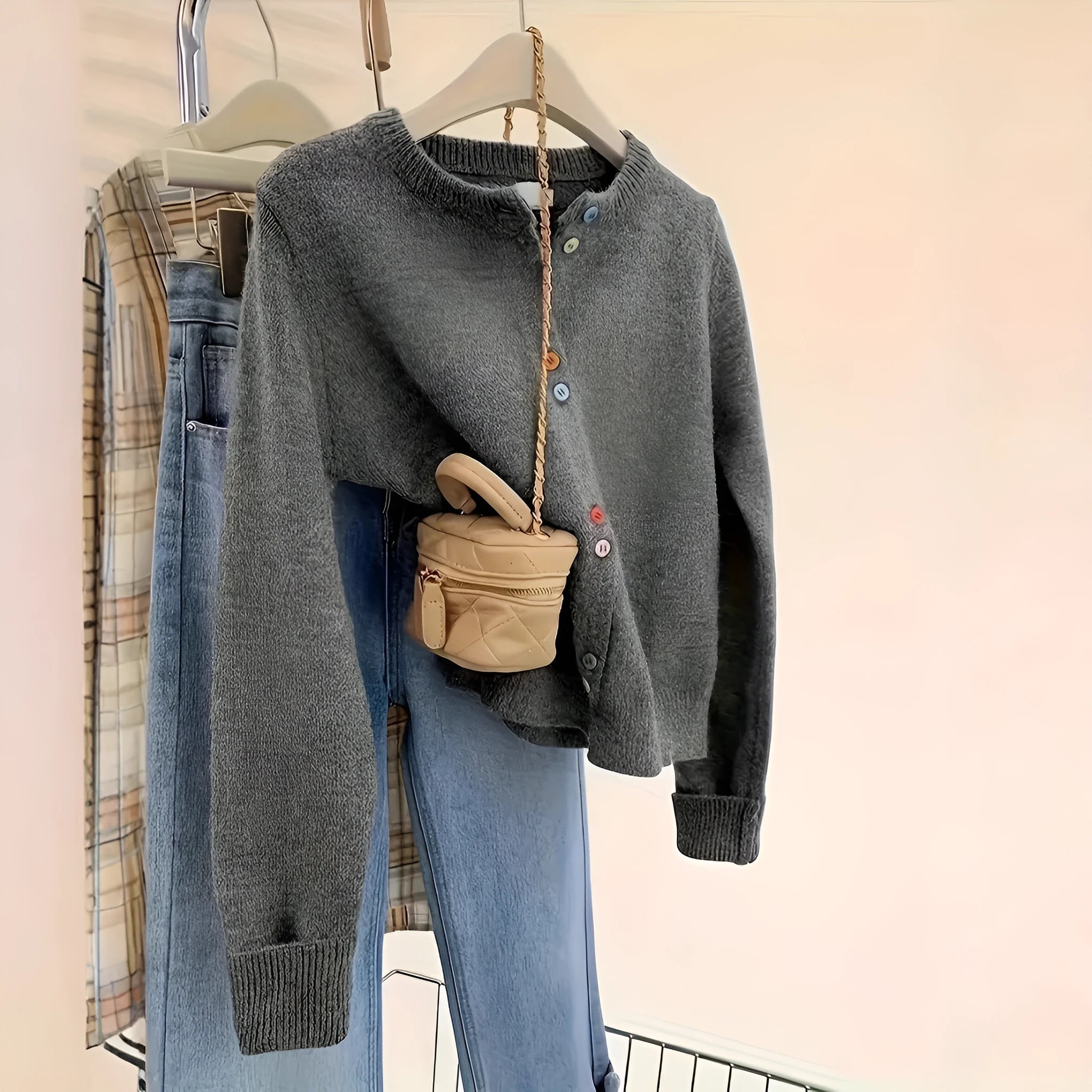 Dark grey women's button-front cardigan sweater for commute and workwear layering