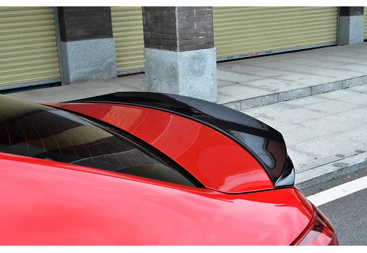 Mazda 3 Axela Exela large fixed sports blade tail trim in bright black or carbon grain finish for 2014-2021 RS models